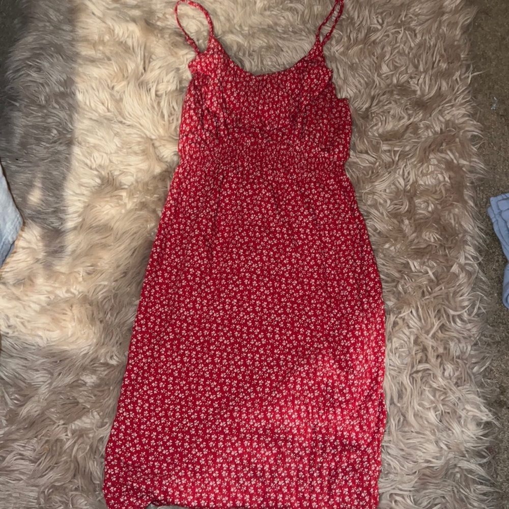 A red dress with white flowers on it size small but very pretty fits great!